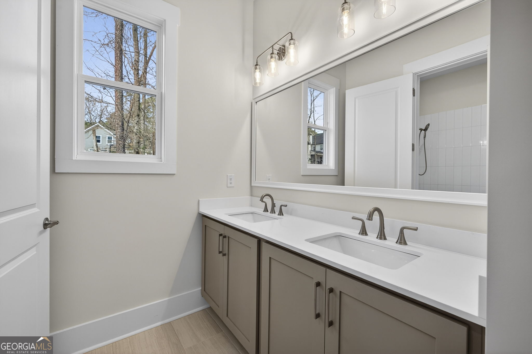 1020 Oak Valley Road Greensboro, GA 30642 - Photo 19 of 64 a bathroom with a sink and a mirror