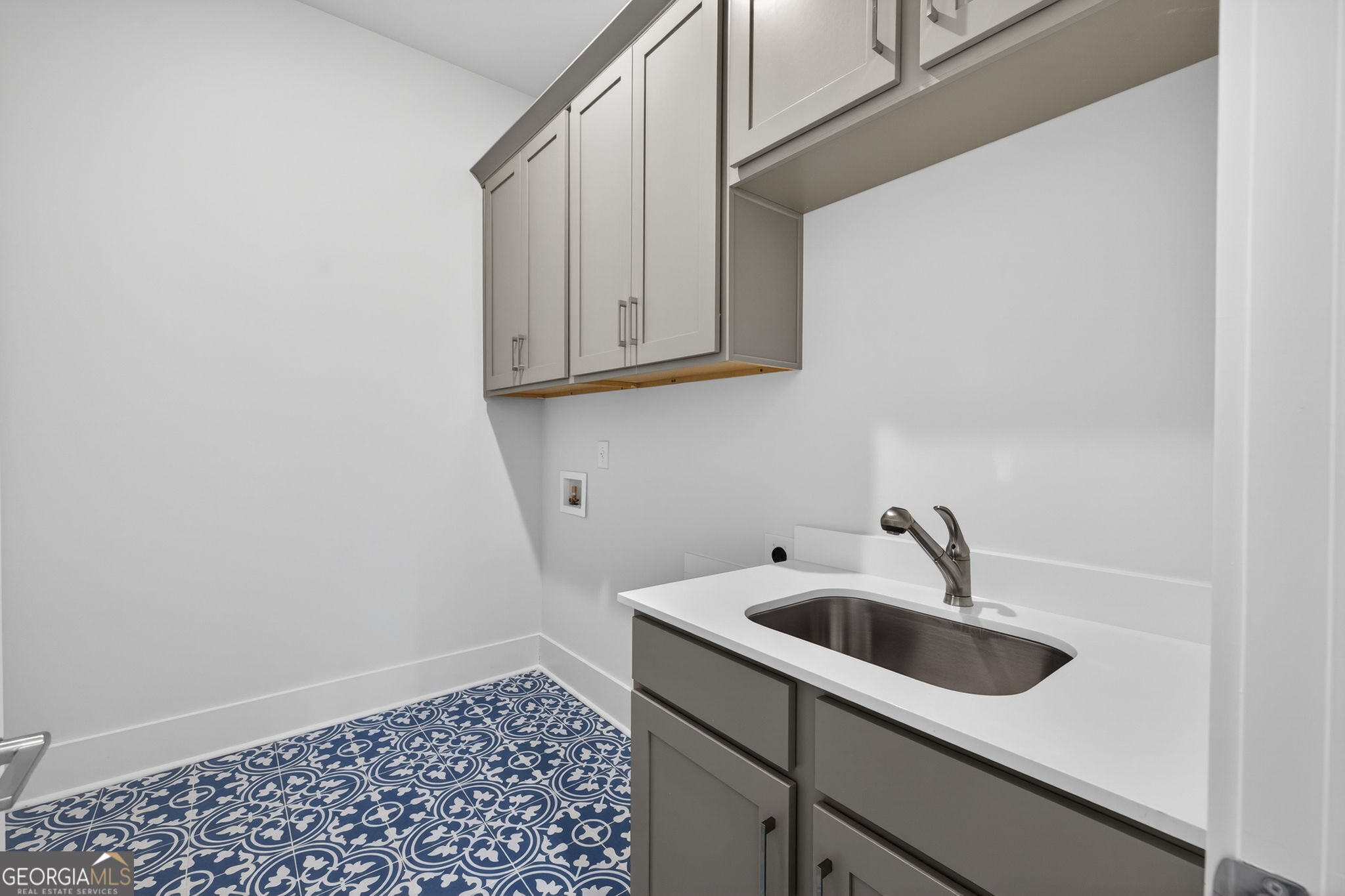 1020 Oak Valley Road Greensboro, GA 30642 - Photo 23 of 64 a bathroom with a sink and cabinets