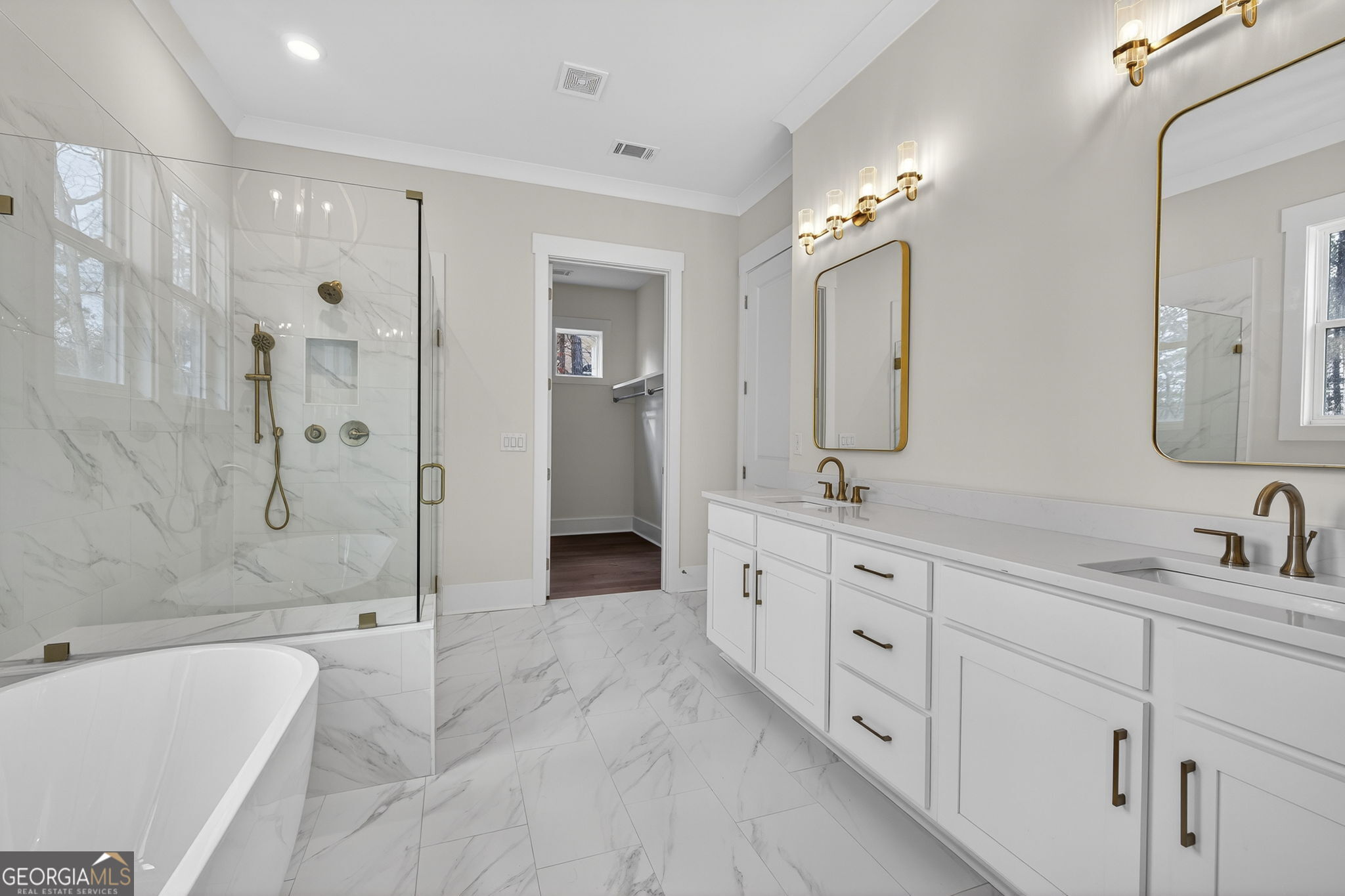 1020 Oak Valley Road Greensboro, GA 30642 - Photo 27 of 64 a spacious bathroom with double vanity a double vanity sink a shower and a mirror
