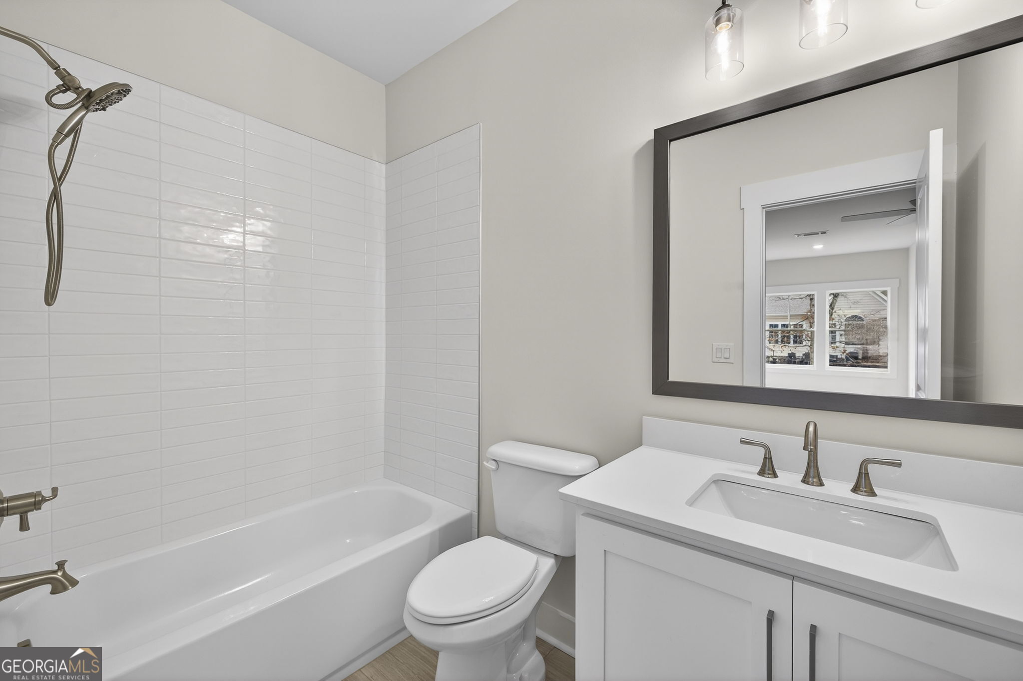 1020 Oak Valley Road Greensboro, GA 30642 - Photo 31 of 64 a bathroom with a sink toilet vanity and shower