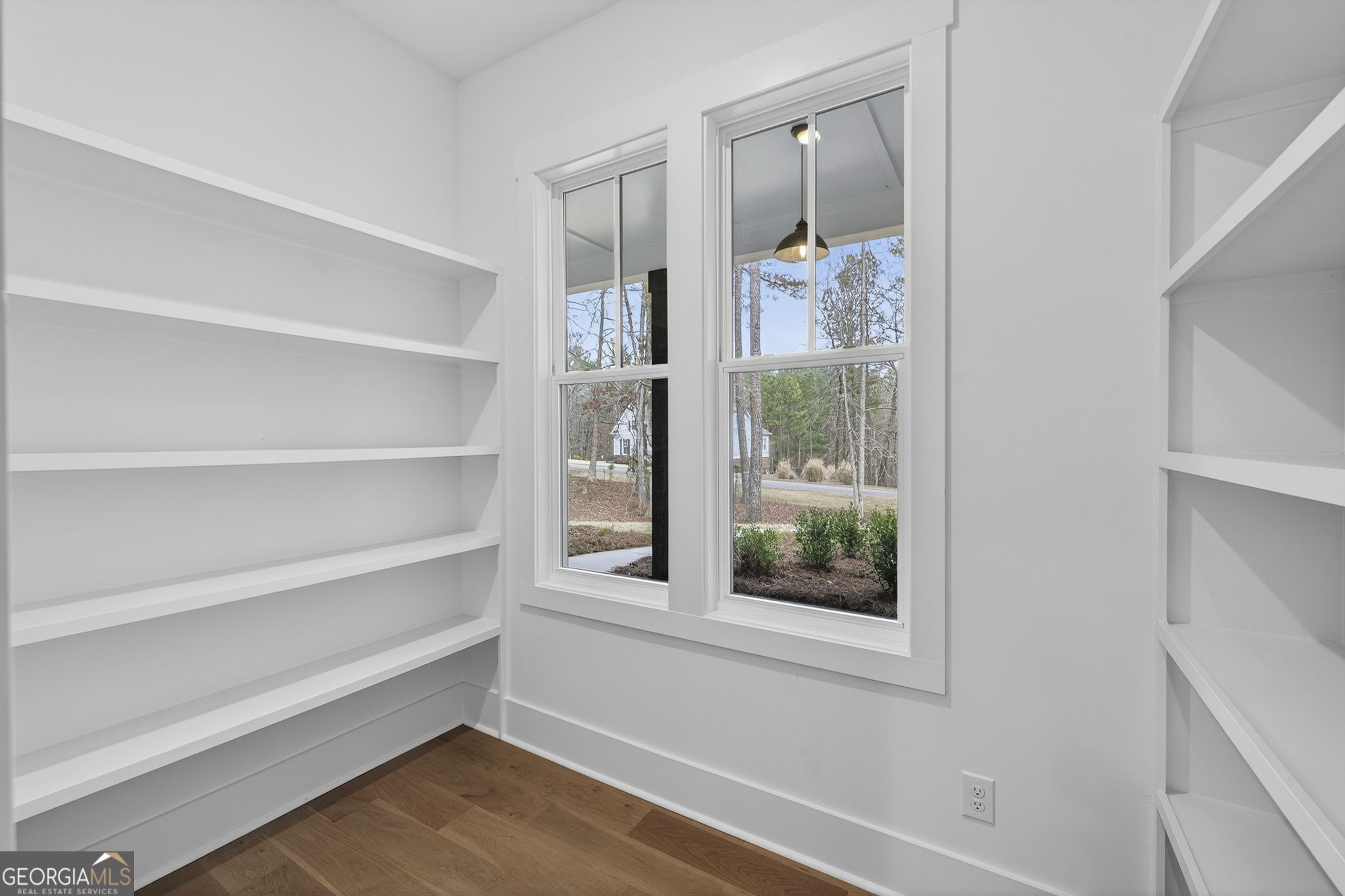 1020 Oak Valley Road Greensboro, GA 30642 - Photo 36 of 64 a view of a small space with wooden floor and a window