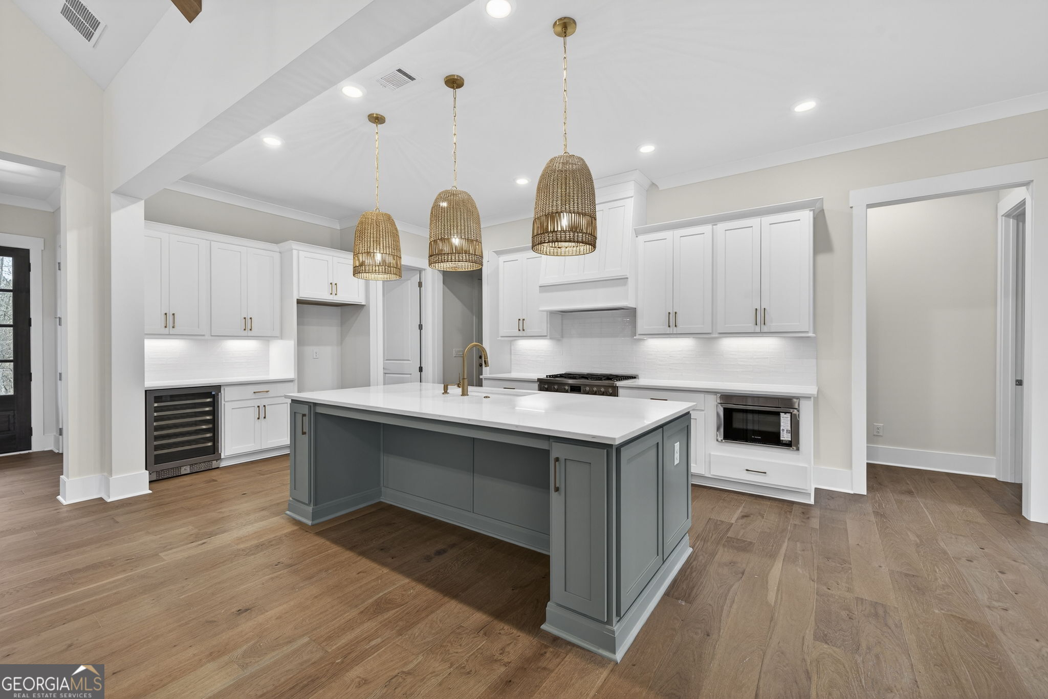 1020 Oak Valley Road Greensboro, GA 30642 - Photo 40 of 64 a kitchen with stainless steel appliances granite countertop a sink a stove and a wooden floors