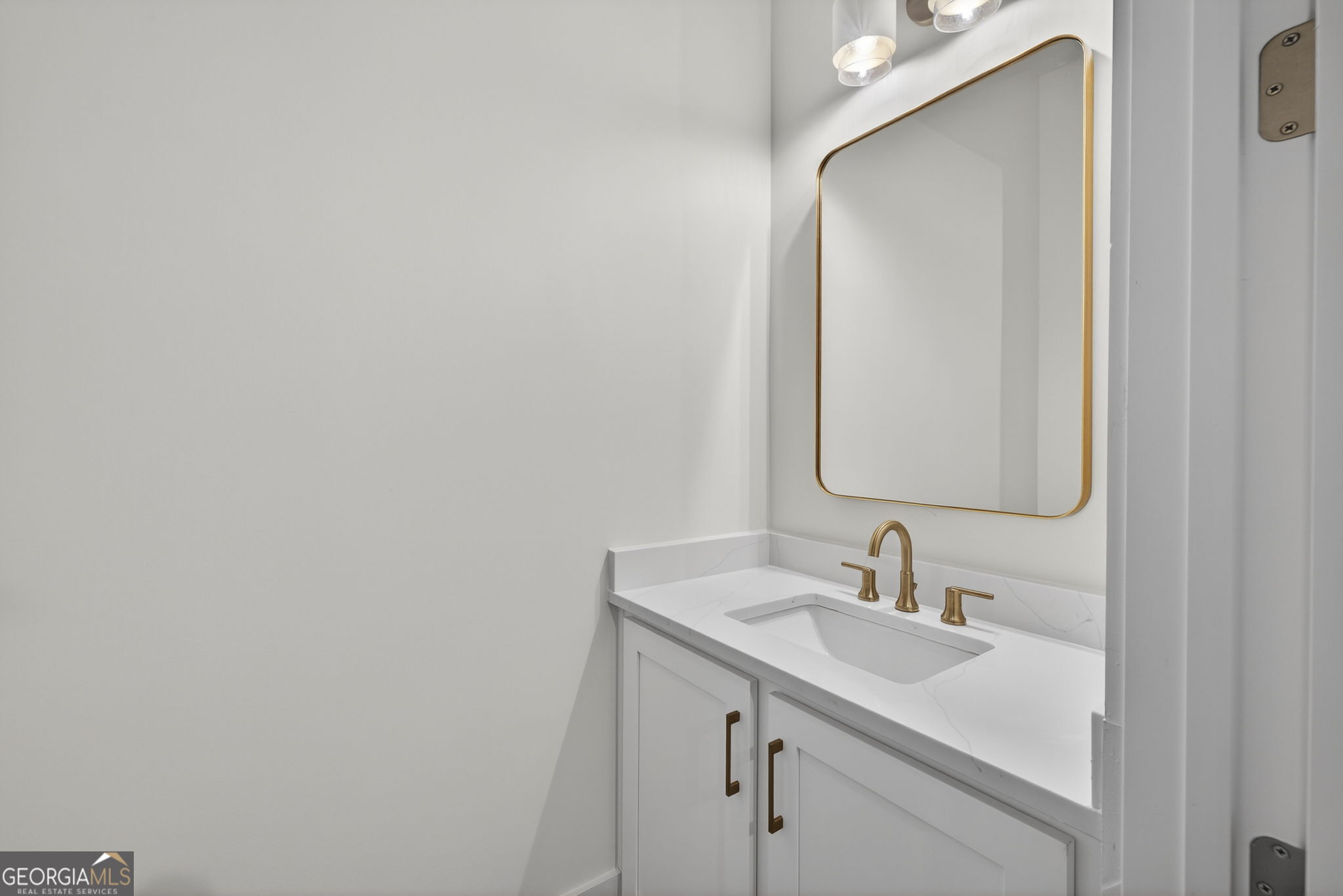 1020 Oak Valley Road Greensboro, GA 30642 - Photo 45 of 64 a bathroom with a sink and a mirror