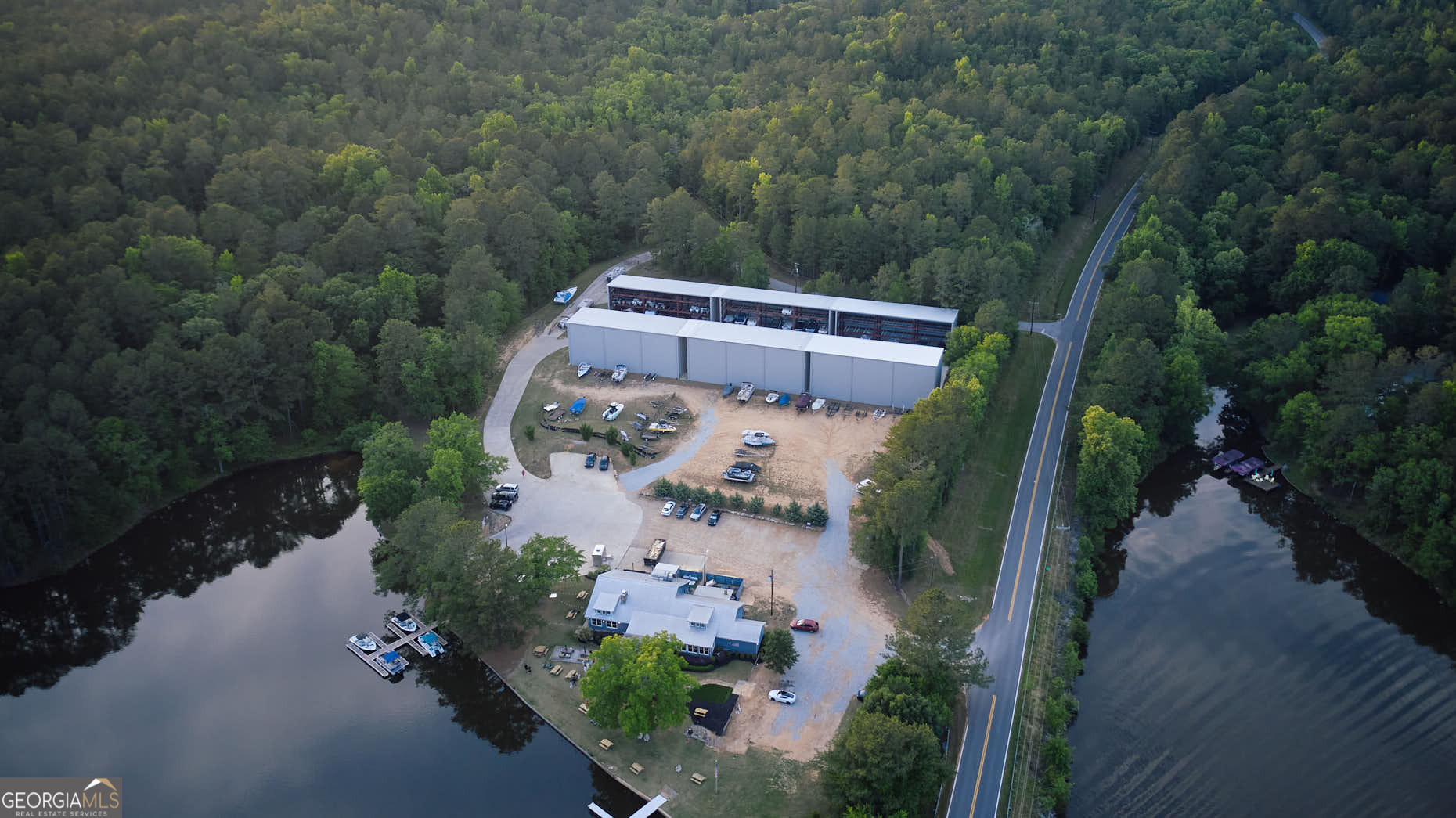 1020 Oak Valley Road Greensboro, GA 30642 - Photo 64 of 64 an aerial view of a house with outdoor space and a lake view