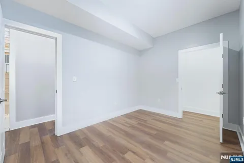 an empty room with wooden floor