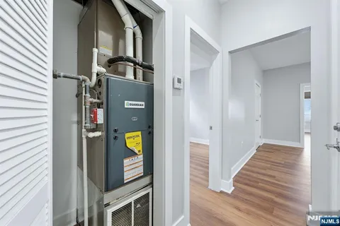 a view of an entryway with wooden floor and stairs