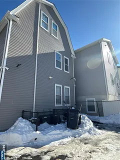 a view of a house with backyard