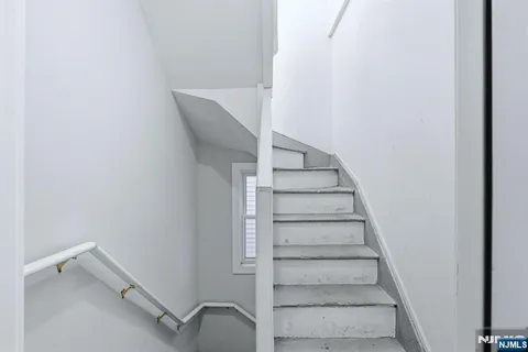 a view of entryway with stairs