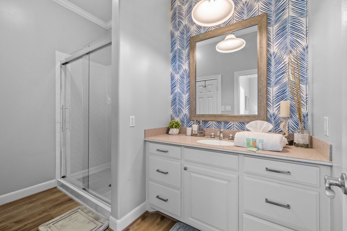 522 Dolphin Drive Freeport, TX 77541 - Photo 27 of 47 a bathroom with a granite countertop sink and a mirror