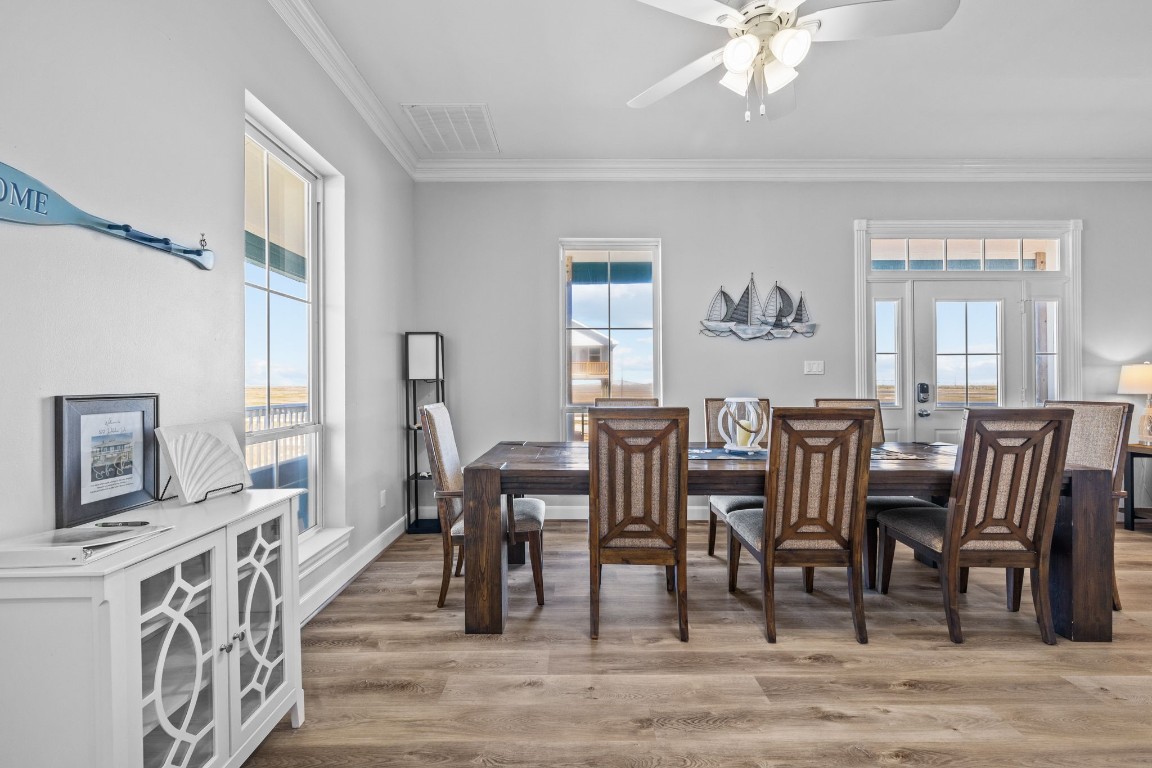 522 Dolphin Drive Freeport, TX 77541 - Photo 31 of 47 a view of a a dining room with furniture window and wooden floor