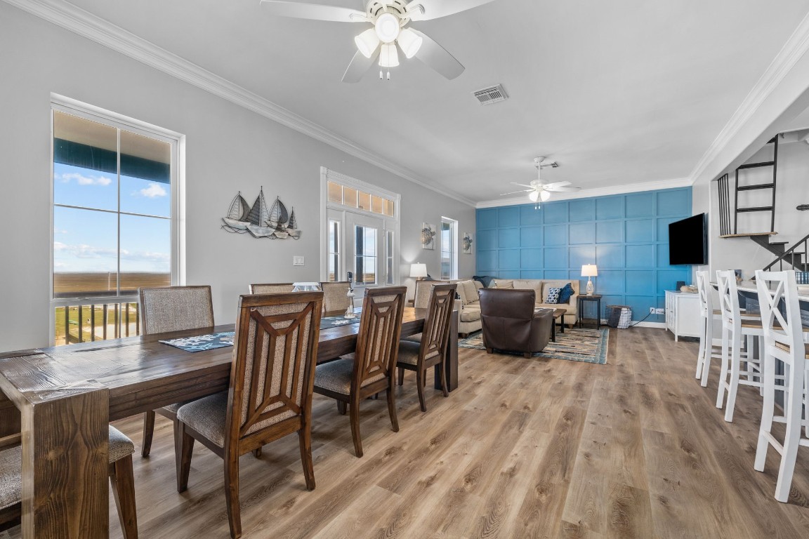 522 Dolphin Drive Freeport, TX 77541 - Photo 32 of 47 a view of a dining room with furniture and chandelier