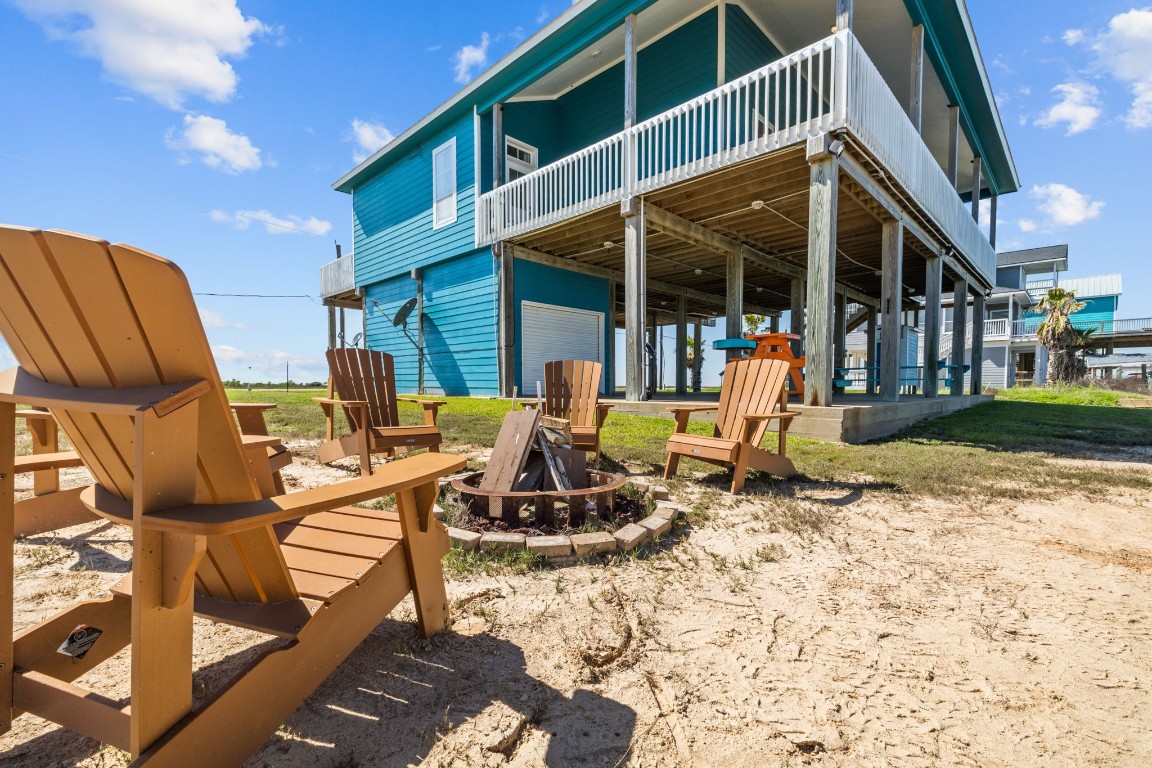 522 Dolphin Drive Freeport, TX 77541 - Photo 4 of 47 a view of a house with backyard outdoor seating area