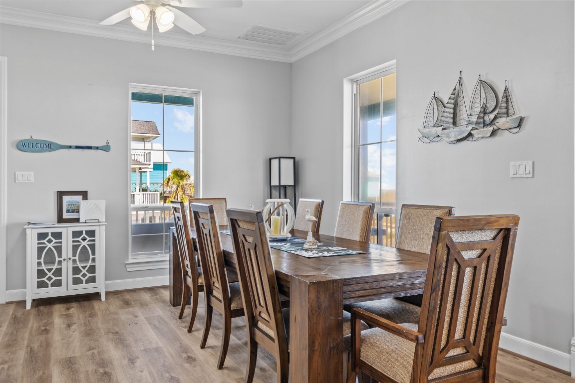 522 Dolphin Drive Freeport, TX 77541 - Photo 41 of 47 a dining room with furniture and wooden floor