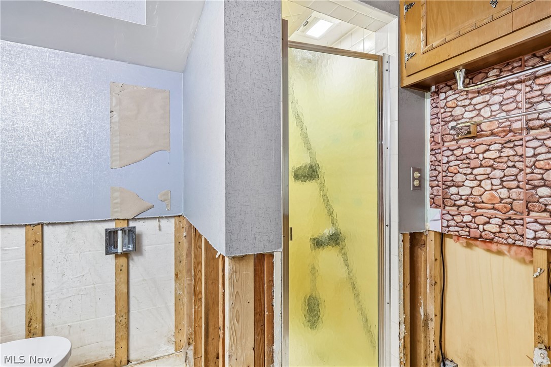 2758 Shellhart Road Norton, OH 44203 - Photo 30 of 41 Lower level bathroom with commode and shower stall