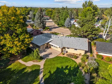 an aerial view of residential houses with outdoor space