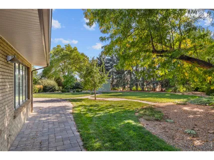 a view of big yard next to a house