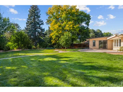 a view of a house with a big yard