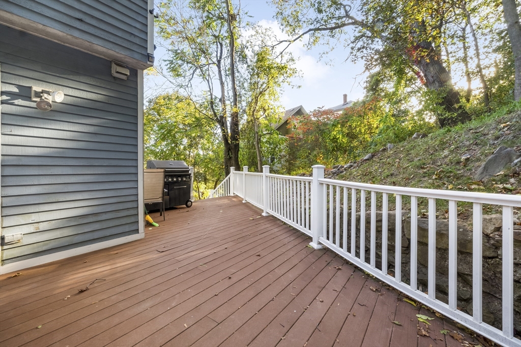 29 A Chilmark Street Worcester, MA 01604 - Photo 11 of 25 a view of a wooden deck and a backyard