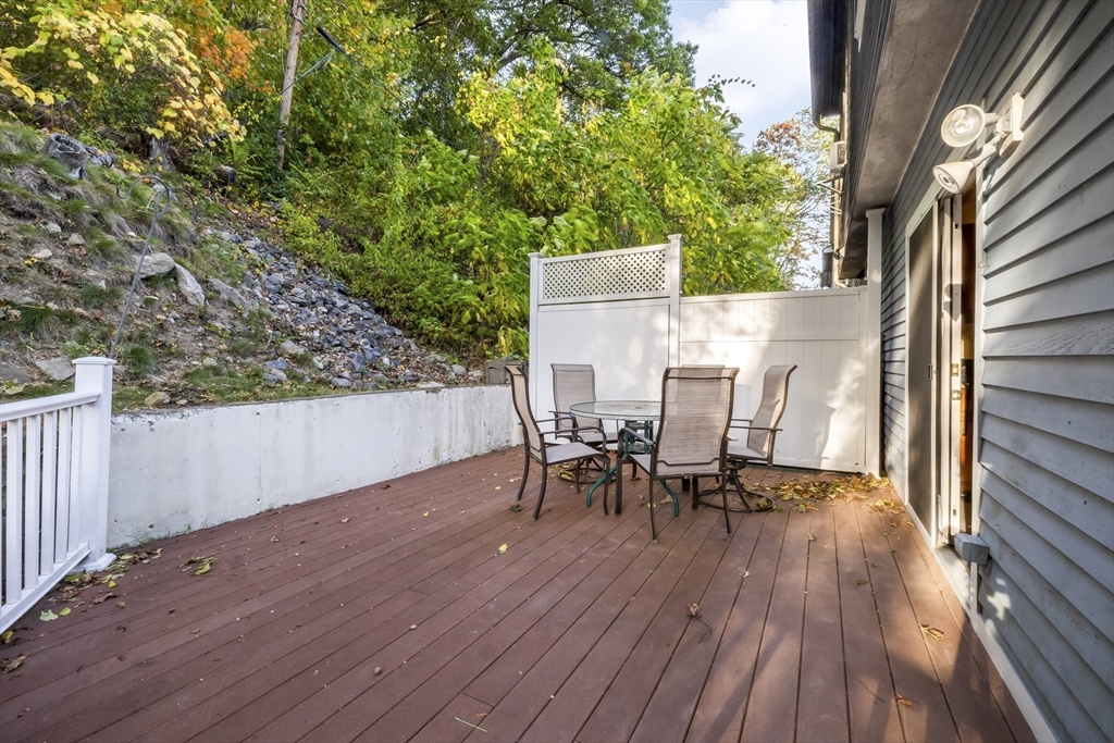29 A Chilmark Street Worcester, MA 01604 - Photo 12 of 25 a view of a patio with table and chairs and wooden floor
