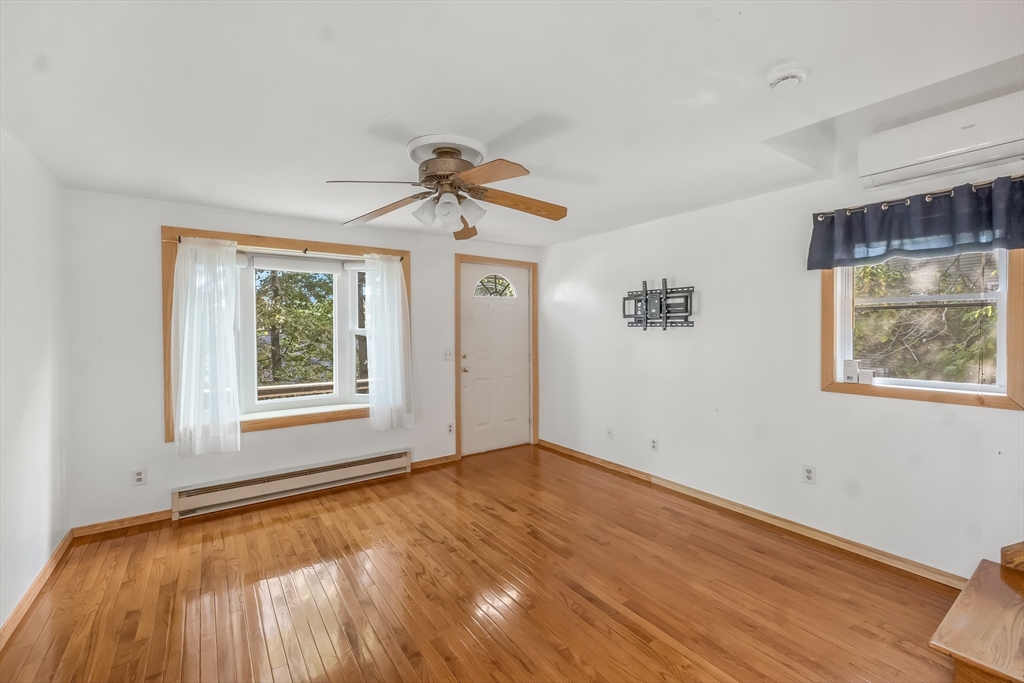 29 A Chilmark Street Worcester, MA 01604 - Photo 2 of 25 a view of an empty room with a window and wooden floor