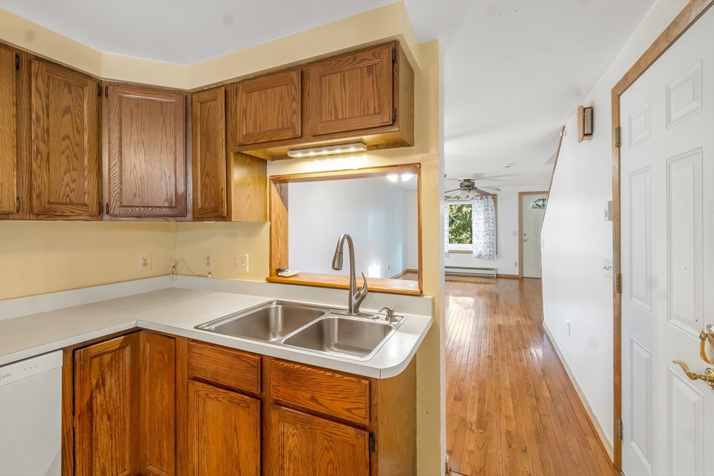 29 A Chilmark Street Worcester, MA 01604 - Photo 5 of 25 a kitchen with a sink cabinets and a wooden floor