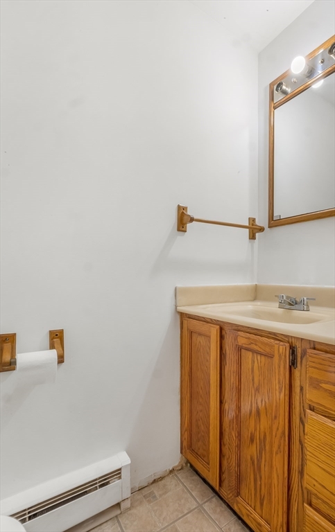 29 A Chilmark Street Worcester, MA 01604 - Photo 10 of 25 a bathroom with a sink and a mirror