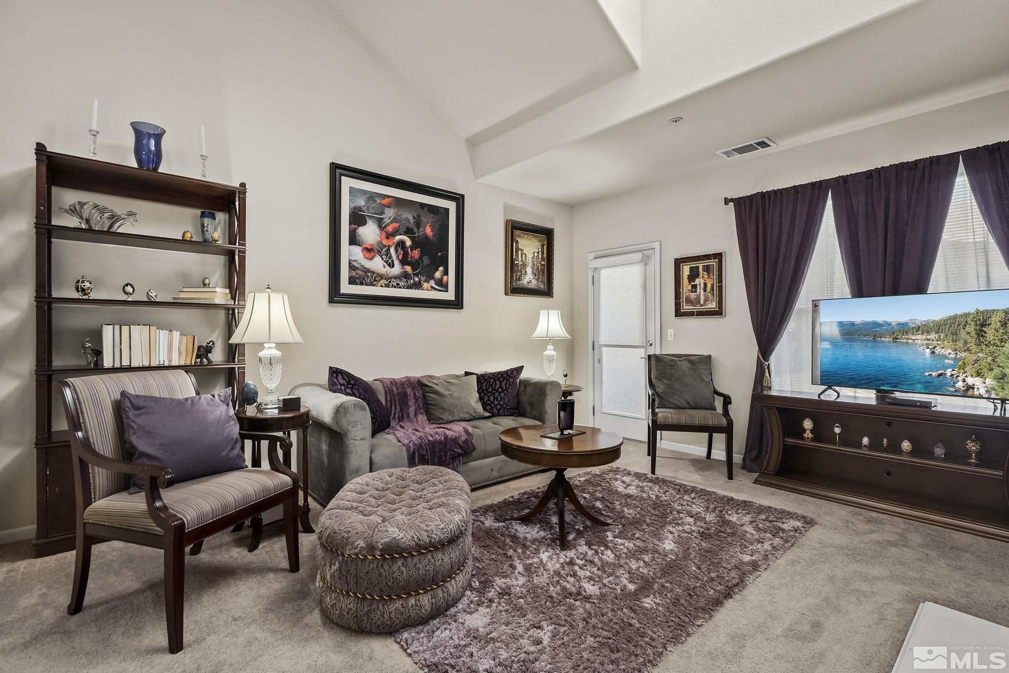 9050 Double R Boulevard, Unit 1622 Reno, NV 89511 - Photo 3 of 25 a living room with furniture a rug and a window