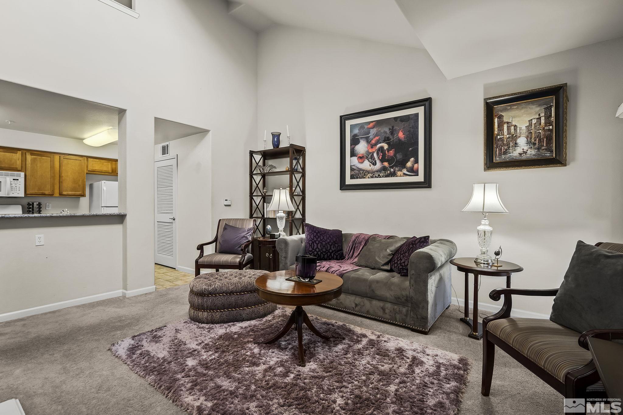 9050 Double R Boulevard, Unit 1622 Reno, NV 89511 - Photo 5 of 25 a living room with furniture and a rug