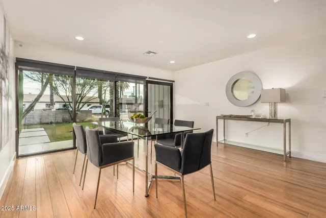 a view of a dining room with furniture window and wooden floor