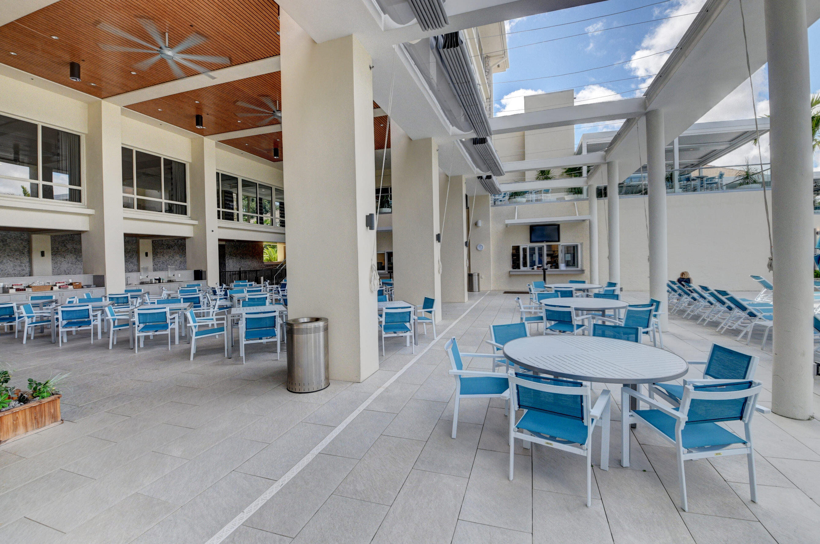 15 Westgate Lane, Unit D Boynton Beach, FL 33436 - Photo 48 of 58 Hunters Run pool eating area 1