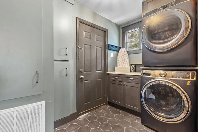 a view of a hallway with washer and dryer