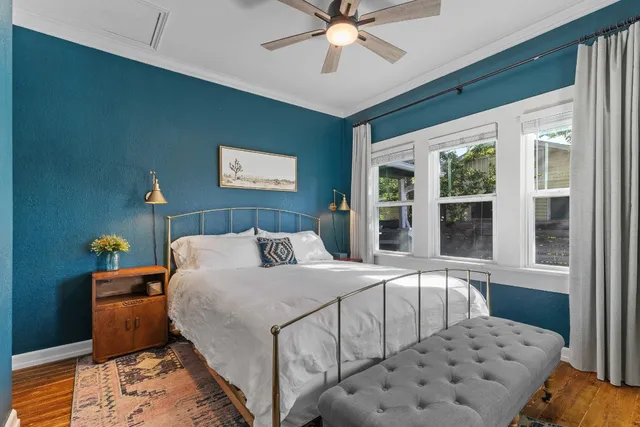 a bedroom with a large bed and a window