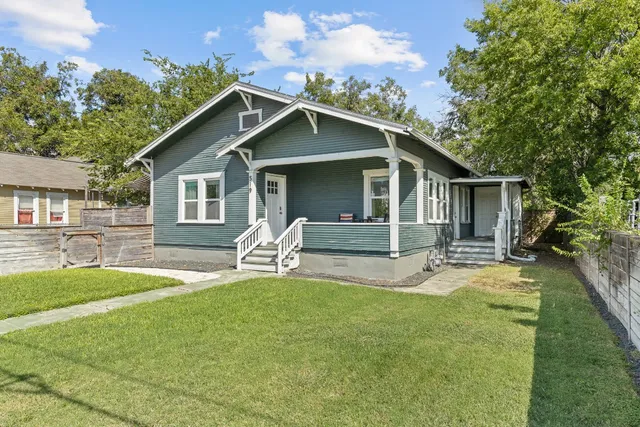 a front view of house with yard and seating area