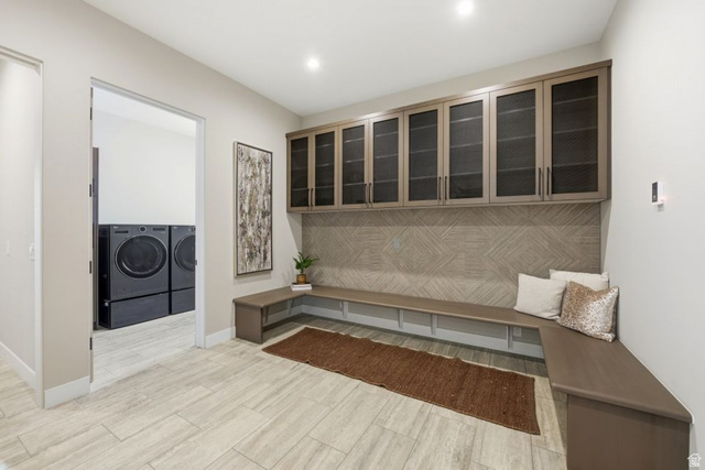 2002 East Outlaw Road Kamas, UT 84036 - Photo 61 of 65 Integrated mudroom with built-in bench seating and overhead cabinetry featuring reeded glass inserts