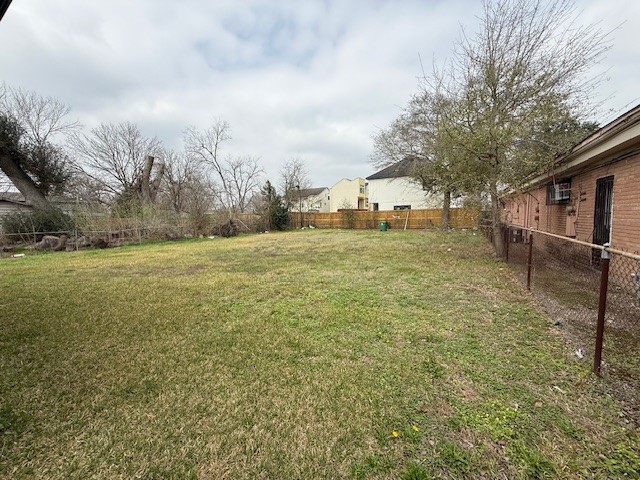 5011 Reed Road Houston, TX 77033 - Photo 5 of 8 a view of an outdoor space and a yard
