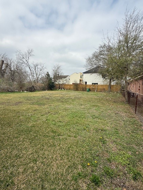 5011 Reed Road Houston, TX 77033 - Photo 6 of 8 a view of a field with an trees in front of it