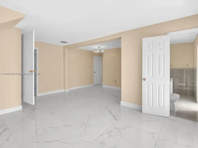 a view of entryway and hall with a front door