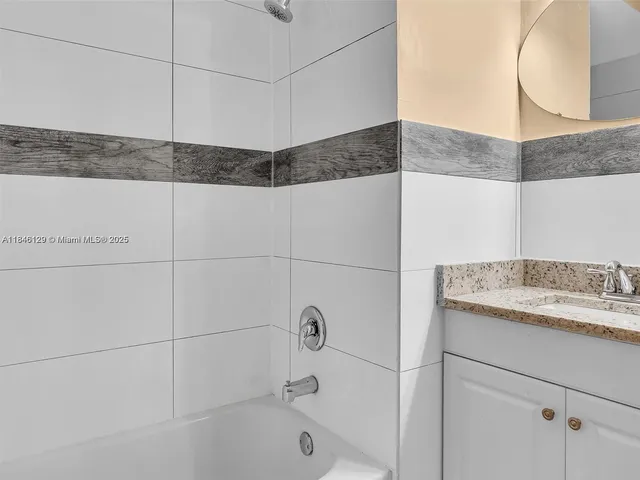 a kitchen with stainless steel appliances granite countertop a sink and a granite counter tops