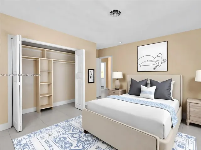 a view of a hallway to rooms