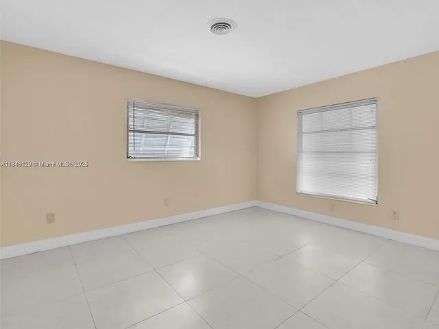 a view of a hallway with wooden shelves
