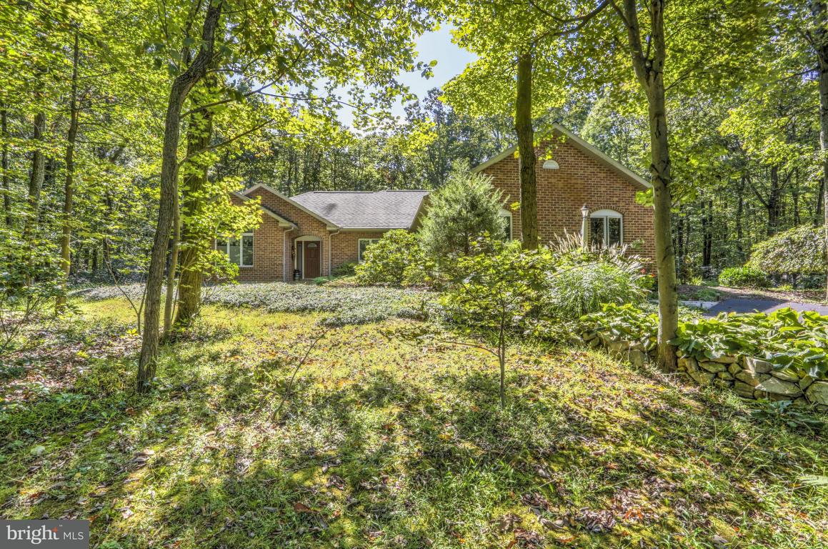 1136 Ranck Road New Holland, PA 17557 - Photo 2 of 37 a house is sitting in middle of the green field