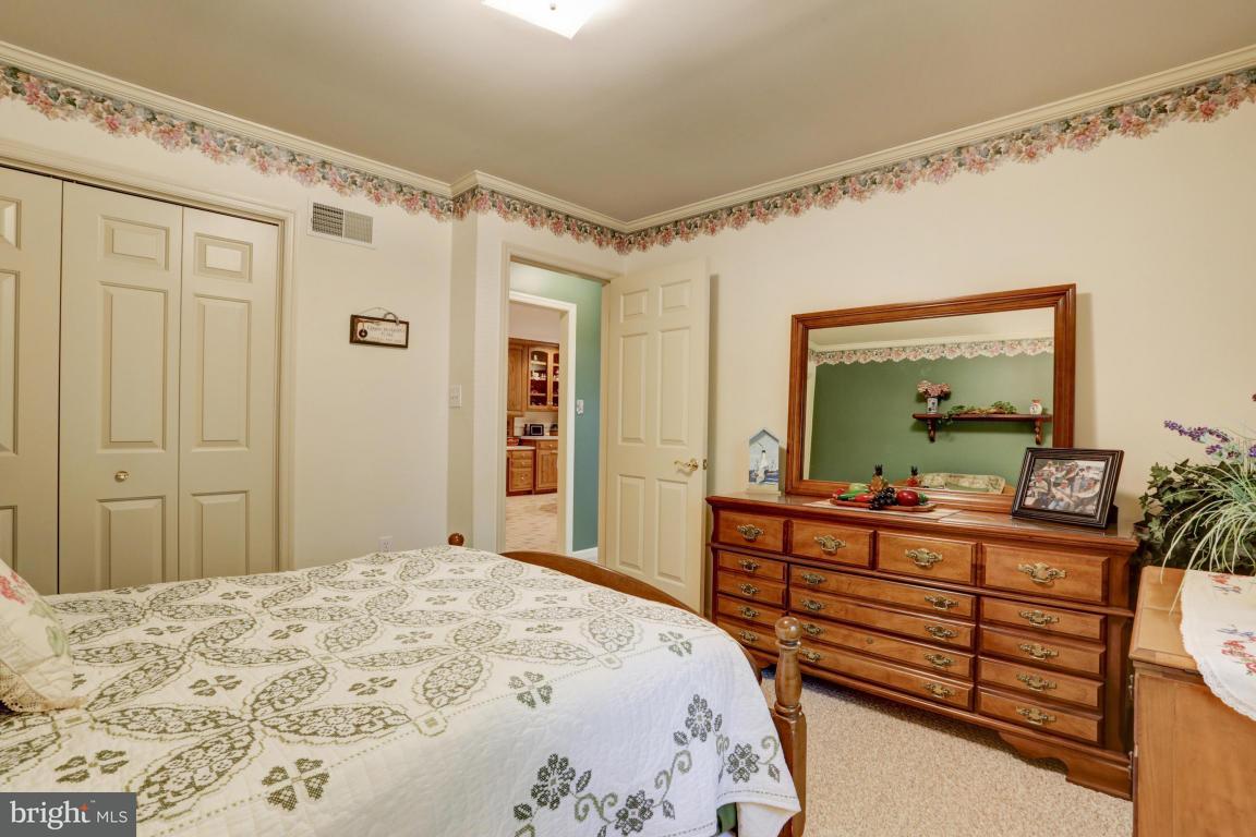 1136 Ranck Road New Holland, PA 17557 - Photo 23 of 37 a bedroom with a bed and a dresser in it