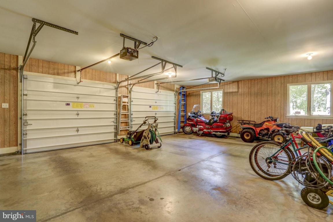 1136 Ranck Road New Holland, PA 17557 - Photo 27 of 37 a view of a garage with a bike and a large window