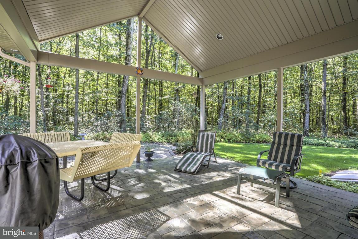 1136 Ranck Road New Holland, PA 17557 - Photo 32 of 37 a view of a patio with a table chairs and a yard