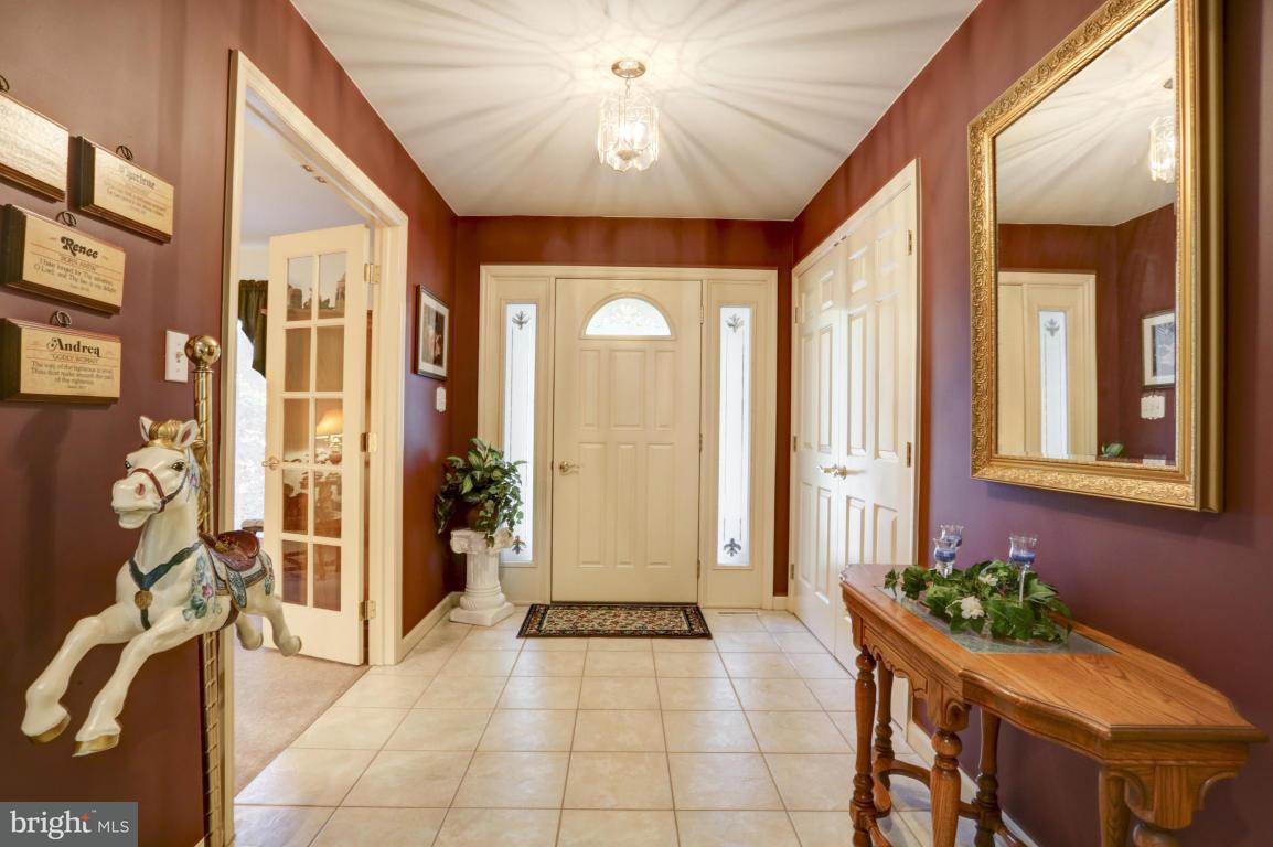 1136 Ranck Road New Holland, PA 17557 - Photo 5 of 37 a view of a hallway with furniture and a chandelier