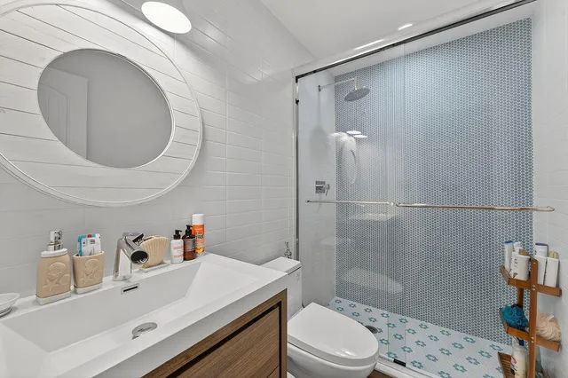 a bed room with a bed and a large window