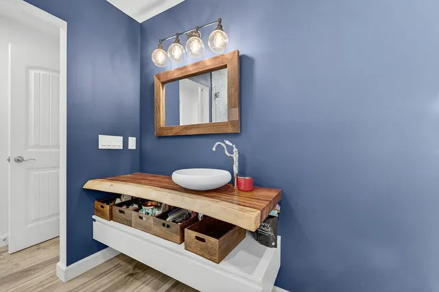 a view of a dining room with furniture and a chandelier