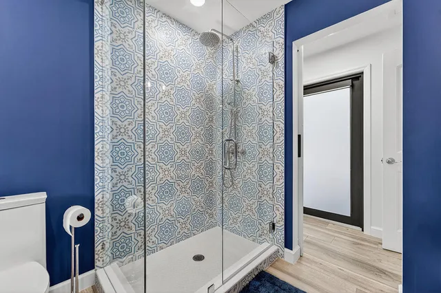 a dining room with furniture a chandelier and window