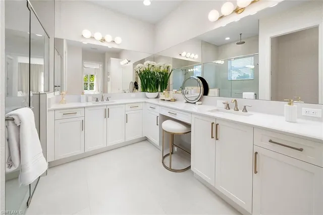a spacious bathroom with a double vanity sink and a mirror