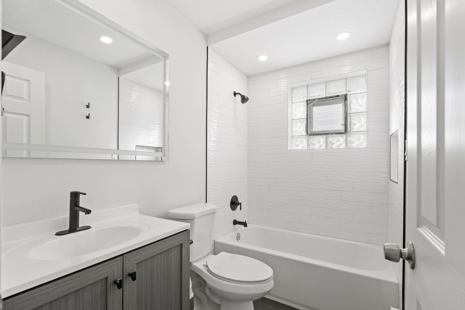 7242 West 86th Street, Unit 3A Bridgeview, IL 60455 - Photo 5 of 14 a bathroom with a sink a toilet and shower